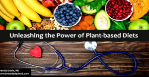 A variety of fruits, nuts, and vegetables are displayed at the top. A stethoscope with a red heart-shaped object is at the bottom. The text reads, Unleashing the Power of Vegan Diets. Brenda Davis, RD, esteemed dietitian, is mentioned in the bottom left corner.